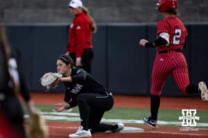 Omaha Mavericks Haley Wilwerding makes an out against Nebraska Cornhusker Lauren Camenzind (2) in the fourth innning during a college softball game on Wednesday, March 26, 2025, in Omaha, Nebraska. Photo by John S. Peterson.
