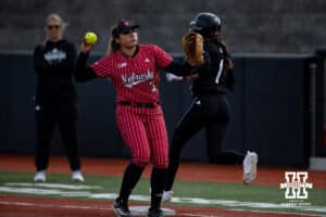 Nebraska Cornhusker Bella Bacon (3) forces out Omaha Maverick infielder Maggie O'Brien (1) during a college softball game on Wednesday, March 26, 2025, in Omaha, Nebraska. Photo by John S. Peterson.