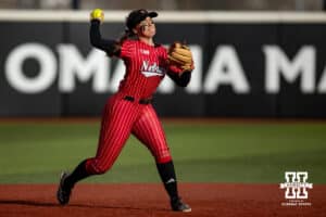 Nebraska Cornhusker Ava Kuszak (7) throws to first against the Omaha Mavericks during a college softball game on Wednesday, March 26, 2025, in Omaha, Nebraska. Photo by John S. Peterson.