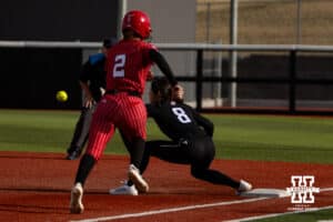 Omaha Maverick infielder Haley Wilwerding (8) makes an out at first against Nebraska Cornhusker Lauren Camenzind (2) during a college softball game on Wednesday, March 26, 2025, in Omaha, Nebraska. Photo by John S. Peterson.