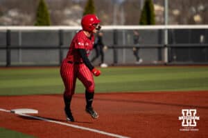Nebraska Cornhusker Ava Kuszak (7) celebrates watching the ball go over the wall for a grand slam by Olivia DiNardo against the Omaha Mavericks in the first inning during a college softball game on Wednesday, March 26, 2025, in Omaha, Nebraska. Photo by John S. Peterson.