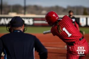Nebraska Cornhusker Olivia DiNardo (1) hits a grand slam home run against the Omaha Mavericks in the first during a college softball game on Wednesday, March 26, 2025, in Omaha, Nebraska. Photo by John S. Peterson.