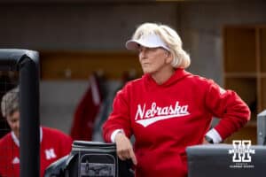 Nebraska Cornhusker head coach Rhonda Revelle watching warm ups before taking on the Omaha Mavericks during a college softball game on Wednesday, March 26, 2025, in Omaha, Nebraska. Photo by John S. Peterson.