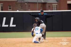 Omaha Mavericks Marra Cramer avoids being thrown out during a college softball game against Creighton on April 1st, 2025 in Omaha, Nebraska. Photo by Brandon Tiedemann.