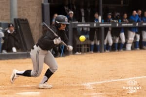 Omaha Mavericks Gabby Salazar bunts during a college softball game against Creighton on April 1st, 2025 in Omaha, Nebraska. Photo by Brandon Tiedemann.