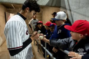 Omaha Maverick Henry Zipay (1) signs an autograph after the win over the Nebraska Cornhuskers during a college baseball game Wednesday, April 2, 2025 in Omaha, Nebraska. Photo by John S. Peterson.