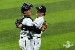 Omaha Maverick catcher Trent Burkhalter (6) gives pitcher Maddox Meyer (28) a hug after the win over the Nebraska Cornhuskers during a college baseball game Wednesday, April 2, 2025 in Omaha, Nebraska. Photo by John S. Peterson.