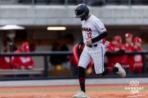 Omaha Maverick Tyler Palmer (12) scores in the third with bases load and batter walked against the Nebraska Cornhuskers during a college baseball game Wednesday, April 2, 2025 in Omaha, Nebraska. Photo by John S. Peterson.