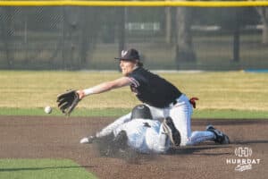 Omaha Skutt Cathloics Nate Christensen steals second base during a high school baseball game against Elkhorn on March 27th, 2025 in Omaha, Nebraska. Photo by Brandon Tiedemann.