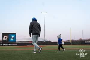 Creighton Bluejays Head Coach Ed Servais walks with a family memeber after a college baseball game against Omaha on March 25th, 2025 in Omaha, Nebraska. Photo by Brandon Tiedemann.