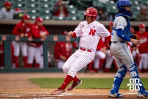 Nebraska Cornhusker utility Max Buettenback (11) scores in the second inning against the Creighton Bluejays during a college baseball game Tuesday, April 1, 2025 in Lincoln, Nebraska. Photo by John S. Peterson.