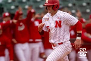 Nebraska Cornhusker infielder Dylan Carey (15) scores in the second inning against the Creighton Bluejays during a college baseball game Tuesday, April 1, 2025 in Lincoln, Nebraska. Photo by John S. Peterson.