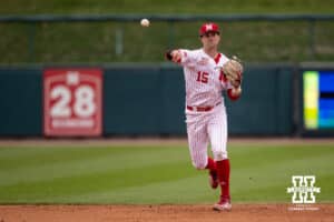 Nebraska Cornhusker infielder Dylan Carey (15) throws to first for an out against the Creighton Bluejays in the second inning during a college baseball game Tuesday, April 1, 2025 in Lincoln, Nebraska. Photo by John S. Peterson.