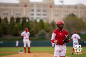 Nebraska Cornhusker catcher Hogan Helligso (10) walks back to home plate after Nebraska Cornhusker pitcher Jalen Worthley (42) in to pitch for Coats in the first inning during a college baseball game Tuesday, April 1, 2025 in Lincoln, Nebraska. Photo by John S. Peterson.