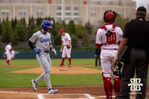 Creighton Bluejay infielder Nolan Sailors (1) scores with bases loaded and MacLean walk against the Nebraska Cornhuskers during a college baseball game Tuesday, April 1, 2025 in Lincoln, Nebraska. Photo by John S. Peterson.