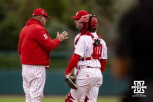 Nebraska Cornhusker pitching coach Rob Childress goes to the mound to talk to the pitcher TJ Coats and the catcher Hogan Helligso against the Creighton Bluejays during a college baseball game Tuesday, April 1, 2025 in Lincoln, Nebraska. Photo by John S. Peterson.