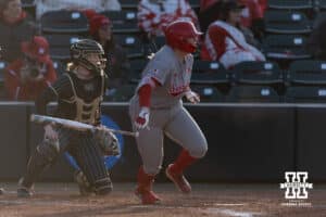 Nebraska Cornhusker Kacie Hoffmann (14) gets a hit in the seventh inning against the Purdue Boilermakers during a college softball game Monday, March 31, 2025 in Lincoln, Nebraska. Photo by John S. Peterson.