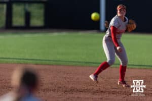 Nebraska Cornhusker Ava Kuszak (7) throws to first for an out during a college softball game Monday, March 31, 2025 in Lincoln, Nebraska. Photo by John S. Peterson.