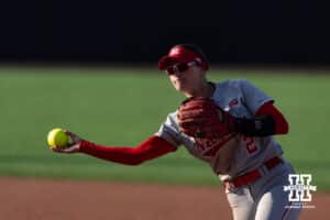 Nebraska Cornhusker Lauren Camenzind (2) throws to first for an out against the Purdue Boilermakers during a college softball game Monday, March 31, 2025 in Lincoln, Nebraska. Photo by John S. Peterson.
