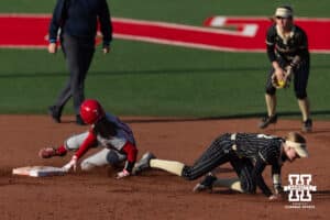 Nebraska Cornhusker Kennadi Williams (15) slides to second base against the Purdue Boilermakers during a college softball game Monday, March 31, 2025 in Lincoln, Nebraska. Photo by John S. Peterson.