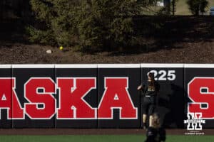 Purdue Boilermaker Ashlynn Campbell (23) watches the ball go over the wall for a homerun by Nebraska Cornhusker Hannah Camenzind (9) in the fifth inning during a college softball game Monday, March 31, 2025 in Lincoln, Nebraska. Photo by John S. Peterson.