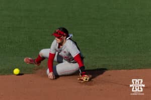 Nebraska Cornhusker Ava Kuszak (7) slides to try an grab the ball against the Purdue Boilermakers during a college softball game Monday, March 31, 2025 in Lincoln, Nebraska. Photo by John S. Peterson.