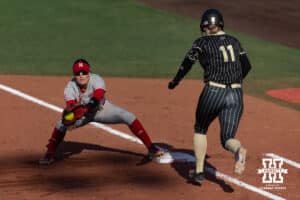 Nebraska Cornhusker Lauren Camenzind (2) makes an out at first base against Purdue Boilermaker catcher Delaney Reefe (11) during a college softball game Monday, March 31, 2025 in Lincoln, Nebraska. Photo by John S. Peterson.