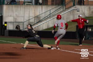 Nebraska Cornhusker Abbie Squier (8) gets a single making it to first base against the Purdue Boilermakers during a college softball game Monday, March 31, 2025 in Lincoln, Nebraska. Photo by John S. Peterson.