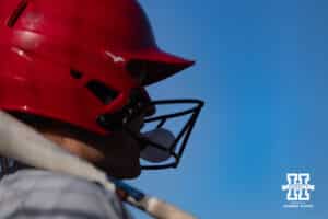 Nebraska Cornhusker Abbie Squier (8) blows a bubble waiting for her at bat against the Purdue Boilermakers during a college softball game Monday, March 31, 2025 in Lincoln, Nebraska. Photo by John S. Peterson.