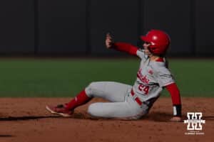 Nebraska Cornhusker Ava Bredwell (24) slides at second against the Purdue Boilermakers during a college softball game Monday, March 31, 2025 in Lincoln, Nebraska. Photo by John S. Peterson.