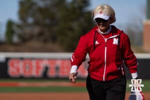 Nebraska Cornhusker head coach Rhonda Revelle walks back to the dugout after a visit to the circle with Kylee Magee against the Purdue Boilermakers in the fourth inning during a college softball game Monday, March 31, 2025 in Lincoln, Nebraska. Photo by John S. Peterson.