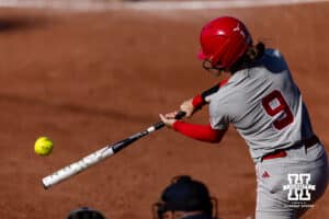 Nebraska Cornhusker Hannah Camenzind (9) gets a hit in the third inning against the Purdue Boilermakers during a college softball game Monday, March 31, 2025 in Lincoln, Nebraska. Photo by John S. Peterson.