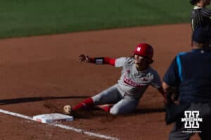 Nebraska Cornhusker Hannah Camenzind (9) slides at third base against the Purdue Boilermakers in the third inning during a college softball game Monday, March 31, 2025 in Lincoln, Nebraska. Photo by John S. Peterson.