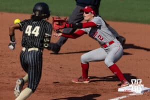 Nebraska Cornhusker Lauren Camenzind (2) makes an out at first base against Purdue Boilermaker outfielder Moriah Polar (44) during a college softball game Monday, March 31, 2025 in Lincoln, Nebraska. Photo by John S. Peterson.