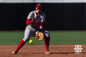 Nebraska Cornhusker Ava Kuszak (7) fields the ball to throw to first for an out against the Purdue Boilermakers in the second inning during a college softball game Monday, March 31, 2025 in Lincoln, Nebraska. Photo by John S. Peterson.