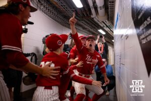 Nebraska Cornhusker Will Jesske (13) leads the Huskers to the bracket board to move the Huskers into the semi-finals against Penn State during the Big Ten Baseball Tournament on Saturday, May 24, 2025 in Omaha, Nebraska. Photo by John S. Peterson.