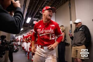 Nebraska Cornhusker Will Jesske (13) leads the Huskers to the bracket board to move the Huskers into the semi-finals against Penn State during the Big Ten Baseball Tournament on Saturday, May 24, 2025 in Omaha, Nebraska. Photo by John S. Peterson.