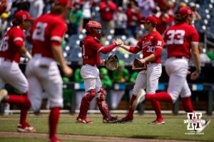 Nebraska Cornhusker pitcher Will Walsh (30) and catcher Hogan Helligso give each other an hug after the win over the Oregon Ducks during the Big Ten Baseball Tournament on Saturday, May 24, 2025 in Omaha, Nebraska. Photo by John S. Peterson.