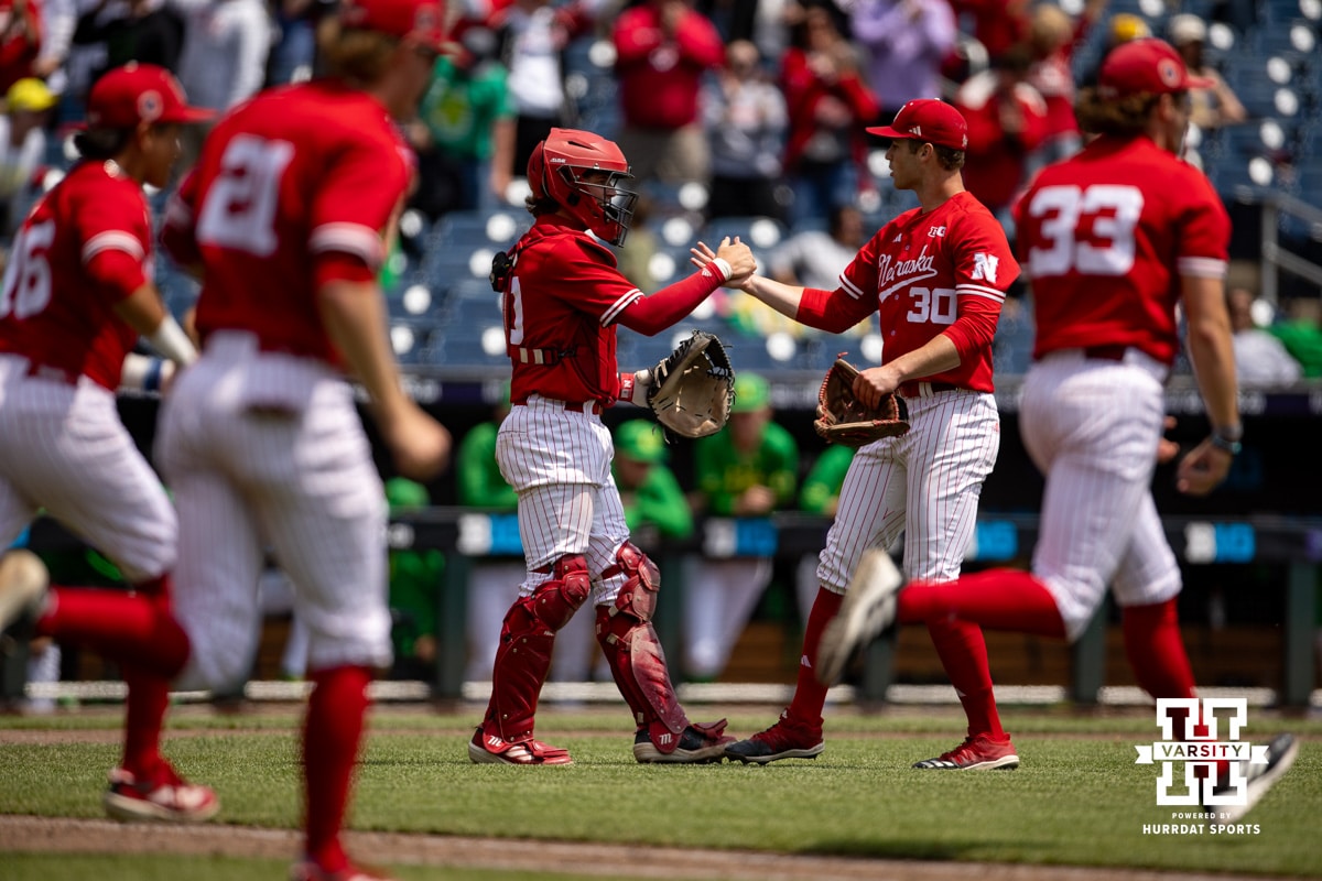 BIg Ten Baseball Nebraska v Oregon | 20250524 Nebraska Cornhusker pitcher Will Walsh (30) and catcher Hogan Helligso give each other an hug after the win over the Oregon Ducks during the Big Ten Baseball Tournament on Saturday, May 24, 2025 in Omaha, Nebraska. Photo by John S. Peterson.