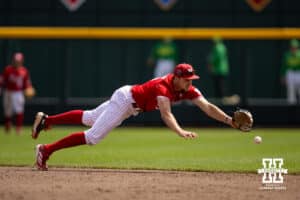 Nebraska Cornhusker infielder Dylan Carey (15) dives for the ball against against the Oregon Ducks in the eighth inning during the Big Ten Baseball Tournament on Saturday, May 24, 2025 in Omaha, Nebraska. Photo by John S. Peterson.