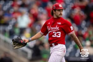 Nebraska Cornhusker pitcher Jackson Brockett (33) walks to the dugout after pitching seveth innings against the Oregon Ducks during the Big Ten Baseball Tournament on Saturday, May 24, 2025 in Omaha, Nebraska. Photo by John S. Peterson.