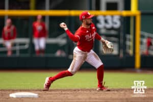 Nebraska Cornhusker second baseman Cayden Brumbaugh (0) throws to first for an out against the Oregon Ducks in the sixth innnnintduring the Big Ten Baseball Tournament on Saturday, May 24, 2025 in Omaha, Nebraska. Photo by John S. Peterson.