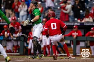 Nebraska Cornhusker Cayden Brumbaugh (0) scores a run against the Oregon Ducks in the fifth inning during the Big Ten Baseball Tournament on Saturday, May 24, 2025 in Omaha, Nebraska. Photo by John S. Peterson.
