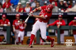 Nebraska Cornhusker Case Sanderson (14) singles in the fifth inning driving in two runs against the Oregon Ducks during the Big Ten Baseball Tournament on Saturday, May 24, 2025 in Omaha, Nebraska. Photo by John S. Peterson.