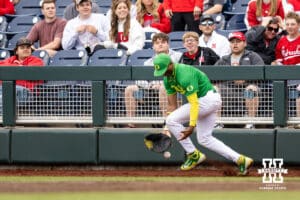 Oregon Duck first baseman Jacob Walsh (25) drops the ball in the fourth inning during the Big Ten Baseball Tournament on Saturday, May 24, 2025 in Omaha, Nebraska. Photo by John S. Peterson.
