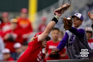 A fan interfered with Nebraska Cornhusker outfielder Robby Bolin (5) trying to make an out against the Oregon Ducks against during the Big Ten Baseball Tournament on Saturday, May 24, 2025 in Omaha, Nebraska. Photo by John S. Peterson.