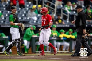 Nebraska Cornhusker Riley Silva (1) scores a run from Gabe Swansen's home run in the first inning against the Oregon Ducks during the Big Ten Baseball Tournament on Saturday, May 24, 2025 in Omaha, Nebraska. Photo by John S. Peterson.