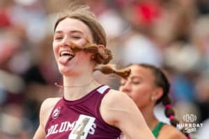 Columbus’s Elizabeth Wemhoff reacts after winning a heat in the 100 meter dash prelims during the NSAA State Track and Field Championships on Wednesday, May 21, 2025 in Omaha, Nebraska. Photo by Mac Johnson.