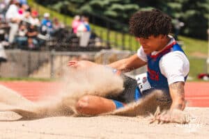 Omaha Westview’s Tayvin Zephier-Murphy lands during a triple jump attempt during the NSAA State Track and Field Championships on Wednesday, May 21, 2025 in Omaha, Nebraska. Photo by Mac Johnson.