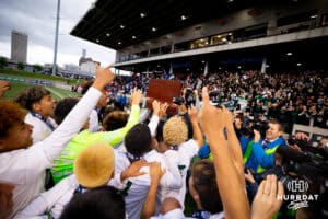 Teammates from Schuyler celebrate their first state soccer title after the NSAA Boys Class B soccer finals on Tuesday, May 20, 2025, in Omaha, Nebraska. Photo by Braden Cochran.